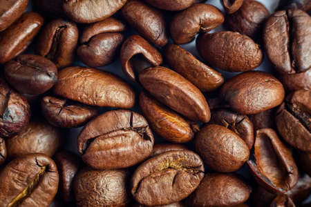 Coffee roasted beans texture background. Beverage, food, morning refreshment