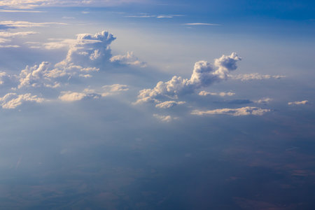 Aerial cumulus cloud in sunlight. Sky texture, air, wind backgroundの写真素材