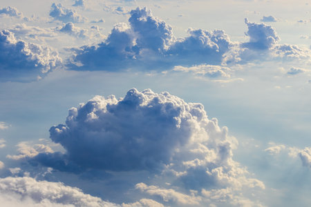 Aerial cumulus cloud in sunlight. Sky texture, air, wind backgroundの写真素材