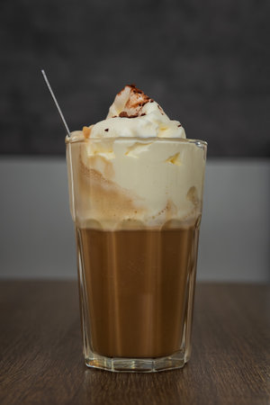 Coffee drink with whipped cream and cinnamon. Home made beverage backgroundの写真素材
