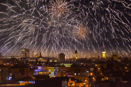 Center of city Ceske Budejovice at night with new year fireworks in skyの写真素材
