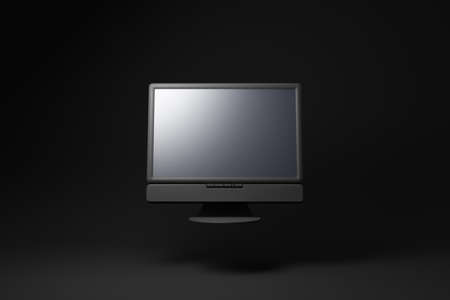 Black computer monitor floating on black background. minimal concept idea. 3d render.の写真素材
