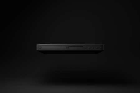 Black dvd player floating on black background. minimal concept idea. monochrome. 3d render.