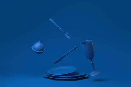 Blue Empty plate, forks, knives, spoons, set in restaurant floating in blue background. minimal concept idea creative. monochrome. 3D render.の写真素材