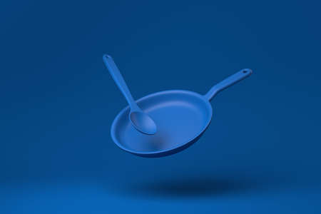 Blue Flying pan floating in blue background. minimal concept idea creative. monochrome. 3D render.の写真素材