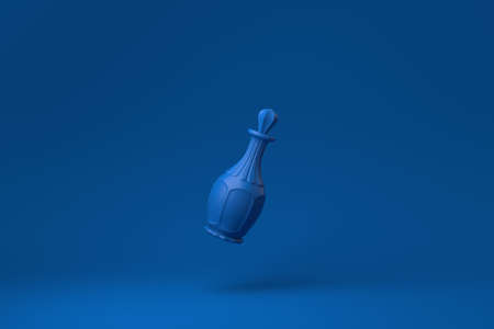 Blue Whiskey Bottle floating in blue background. minimal concept idea creative. monochrome. 3D...