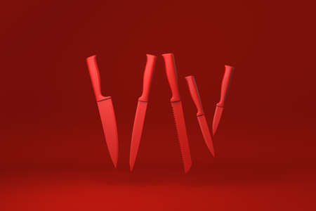 Red Kitchen knives floating in Red background. minimal concept idea creative. monochrome. 3D render.の写真素材