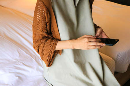 Hand contact of a woman who touches a smartphone