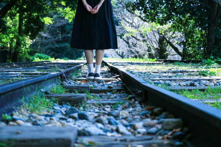 Girl standing on abandoned railways Keage Incline