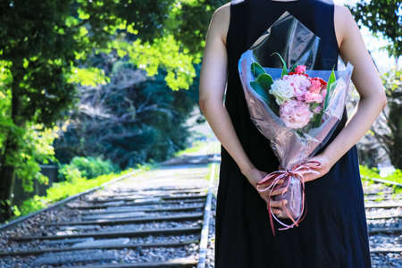 Woman back with bouquet love marriageの写真素材