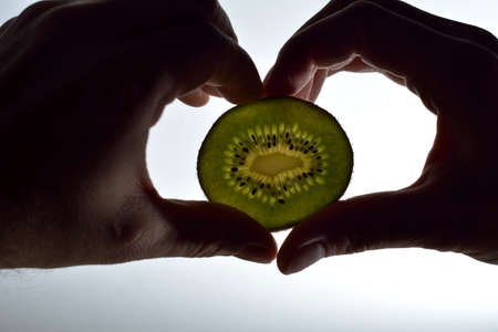 Hand and kiwiの写真素材
