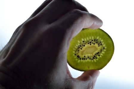 Hand and kiwiの写真素材