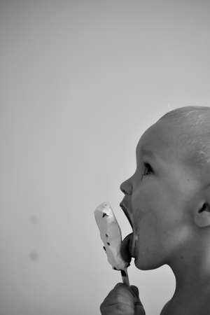 Boy with ice creamの写真素材