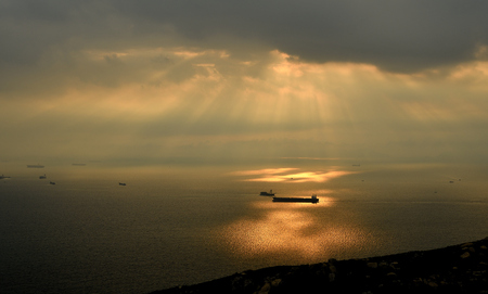 The sea under the beautiful rays of lightの写真素材