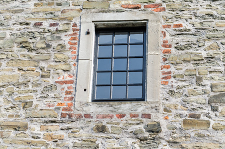Historic window of a castle with stained glassの写真素材