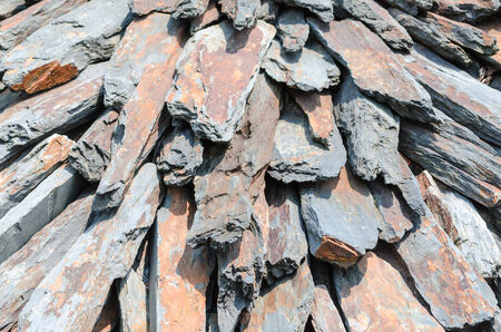 Carefully piled stone slabs in a heap の写真素材