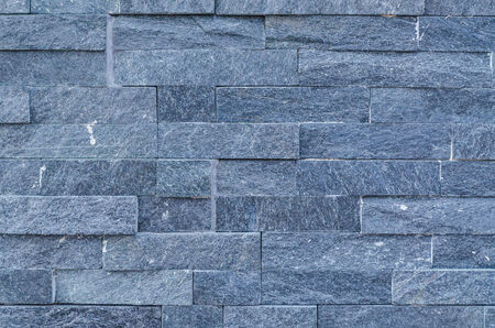 Renovated house wall covered with insulation and with a beautiful brick stone の写真素材