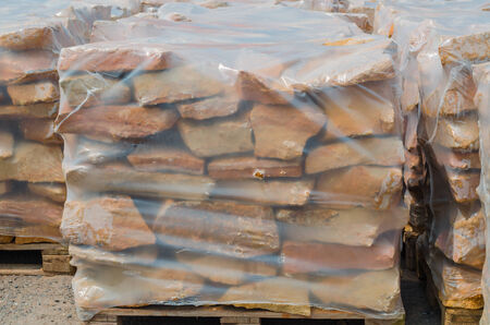 Drywall stones from German sandstone on a pallet ready for processingの写真素材