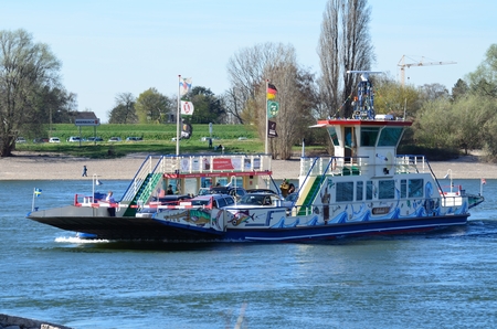 DÃ¼sseldorf, Nrw,  Germany - March 20, 2014  Ferry Michaela II of RheinfÃ¤hrbetrieb SchÃ¤fer GmbH in Dusseldorf connects Kaiserwerth and sea-Busch Langst at Rhine kilometer 755th Here with passengers at the crossing のeditorial素材
