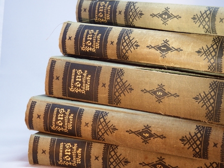 Heiligenhaus, Nrw, Germany - February 12, 2014: Photo of a pile of old books of the famous writer Hermann Lons. Here see the works of 1 to 5 from a total of eight volumes. Hermann Lons was a German writer and journalist. Become known as a regional writer.のeditorial素材