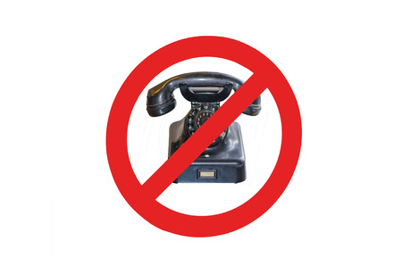 Sign - no cell phones - Telephoning prohibited. Red prohibition sign with old phone.の写真素材