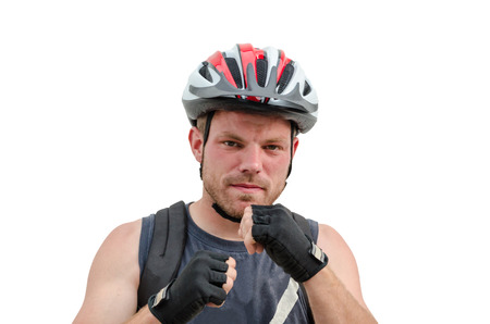 Young sporty man with safety helmet in boxing poseの写真素材
