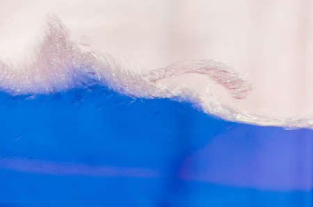 Close up of a blue liquid, water, background image.の写真素材
