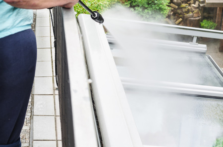 Exterior cleaning and building cleaning a glass roof with high pressure water jet. Exterior cleaning and building cleaning a glass roof with high pressure water jet.