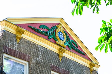 View of one beautiful old roof gable with the inscription year of construction 1774thの写真素材