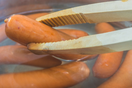 Sausage in a pot with boiling water.の写真素材