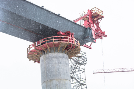 Bridge construction sites, bridge under construction seen in heavy snowfall from below.の写真素材