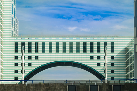 Highway pass right underneath a building in The Hague, Scheveningen in the Netherlands.のeditorial素材