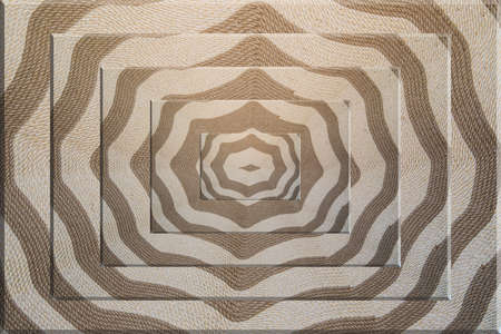 Background image of a hand-woven carpet with ancient ornament.の写真素材