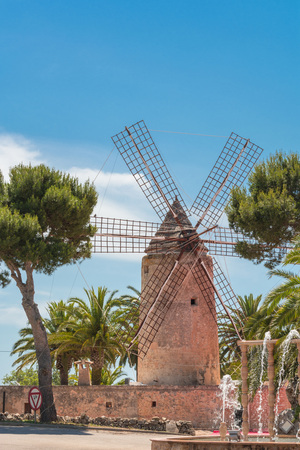Old historic windmill on a farm of Majorca (Spain)の写真素材