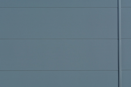 Silver-colored metal wall corrugated sheet metal background.の写真素材