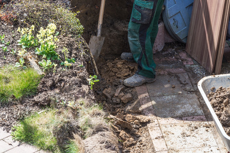 Gardening, loaded a wheelbarrow with earth excavation