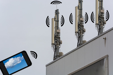 Antenna, telecommunications tower on a roof. Wireless telecommunication concept, home control by...