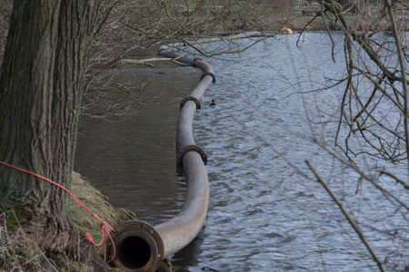 Pipeline, plastic pipes float on the water surface.
