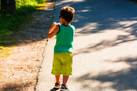 Little boy has fun with the old digital camera
