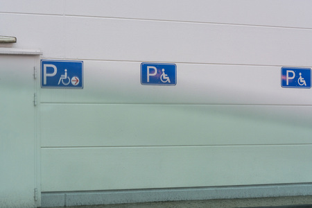 Signs for disabled parking in a public car park.の写真素材