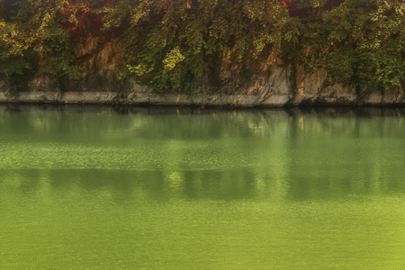 Lake with banks on the site of a former quarry for the extraction of limestone
