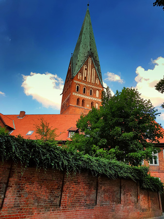 Germany, Cathedral and old houses with blue sky and clouds in the backgroundのeditorial素材