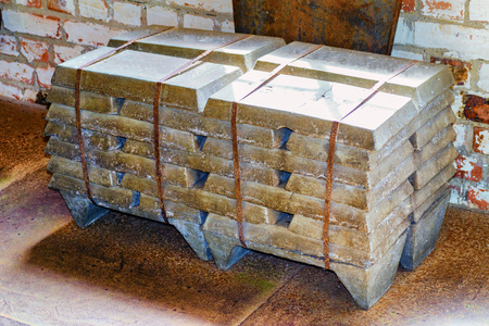 Stack of old raw aluminum ingots in an old foundryのeditorial素材