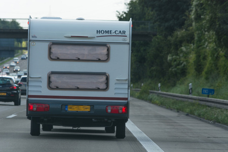 MOTORWAY A 61; GERMANY - AUGUST 13; 2017:
Caravan on the A 61 motorway in tourist traffic near the city Grafschaft.のeditorial素材