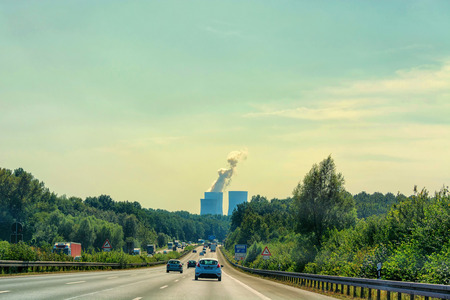 UNNA, GERMANY - AUGUST 2, 2017: Traffic on the A2 motorway and Scholven coal power station, Germany, North Rhine-Westphalia.のeditorial素材