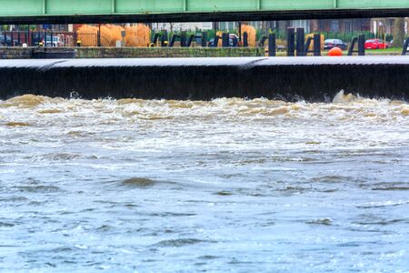 ESSEN, NRW, GERMANY - FEBRUARY 04, 2016: Severe flooding in the river of the Ruhr near the cityEssen Kettwig by storm, wind and heavy rain.のeditorial素材