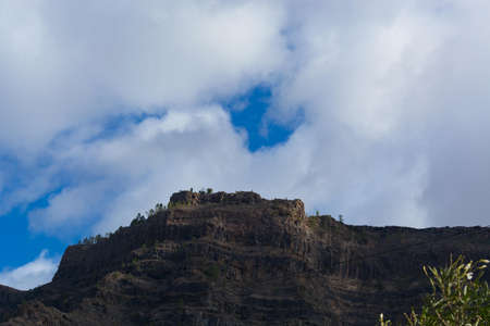 Mountains on the coast between Puerto de Mogan and Puerto Rico. Layers of volcanic rock.の写真素材
