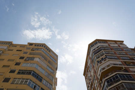 View of the modern multi-storey apartment buildings and sky view. Low angle view of building in...