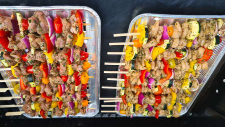 Vegetarian grill: Colorful marinated feta skewers with zucchini, cherry tomatoes and herbs - Grilled marinated feta skewers with Greek cheese, courgette, cherry tomatoes and herbsの写真素材