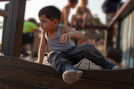 Portrait of cute little baby boy on playgroundの写真素材